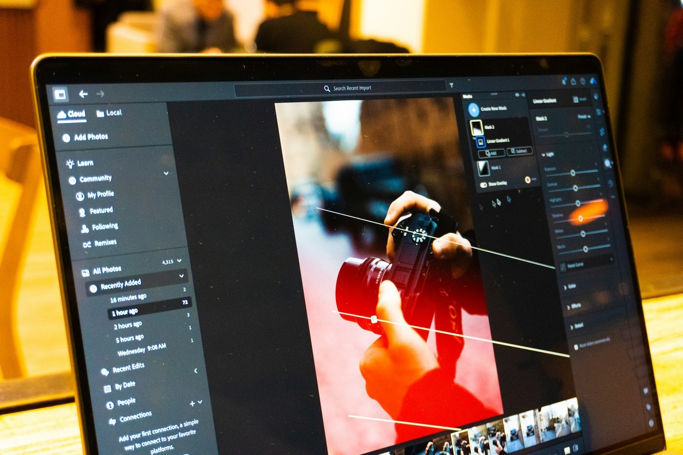 Photo editing software open on a laptop, representing the editing and checking step before uploading Amazon product images