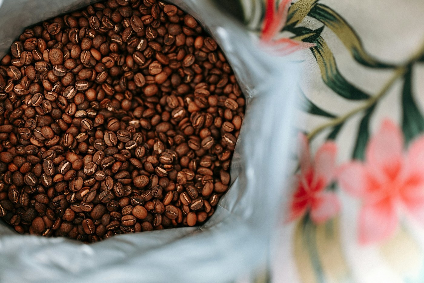 Open bag of roasted coffee beans, representing everyday products customers reorder through Amazon Subscribe and Save
