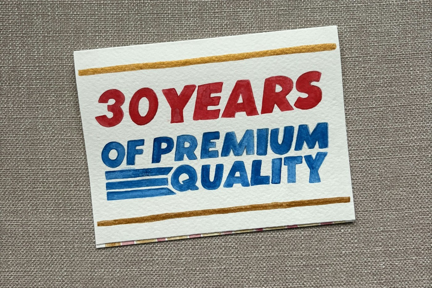 Handmade premium quality label card on fabric, representing authenticated branded product quality for Amazon Transparency