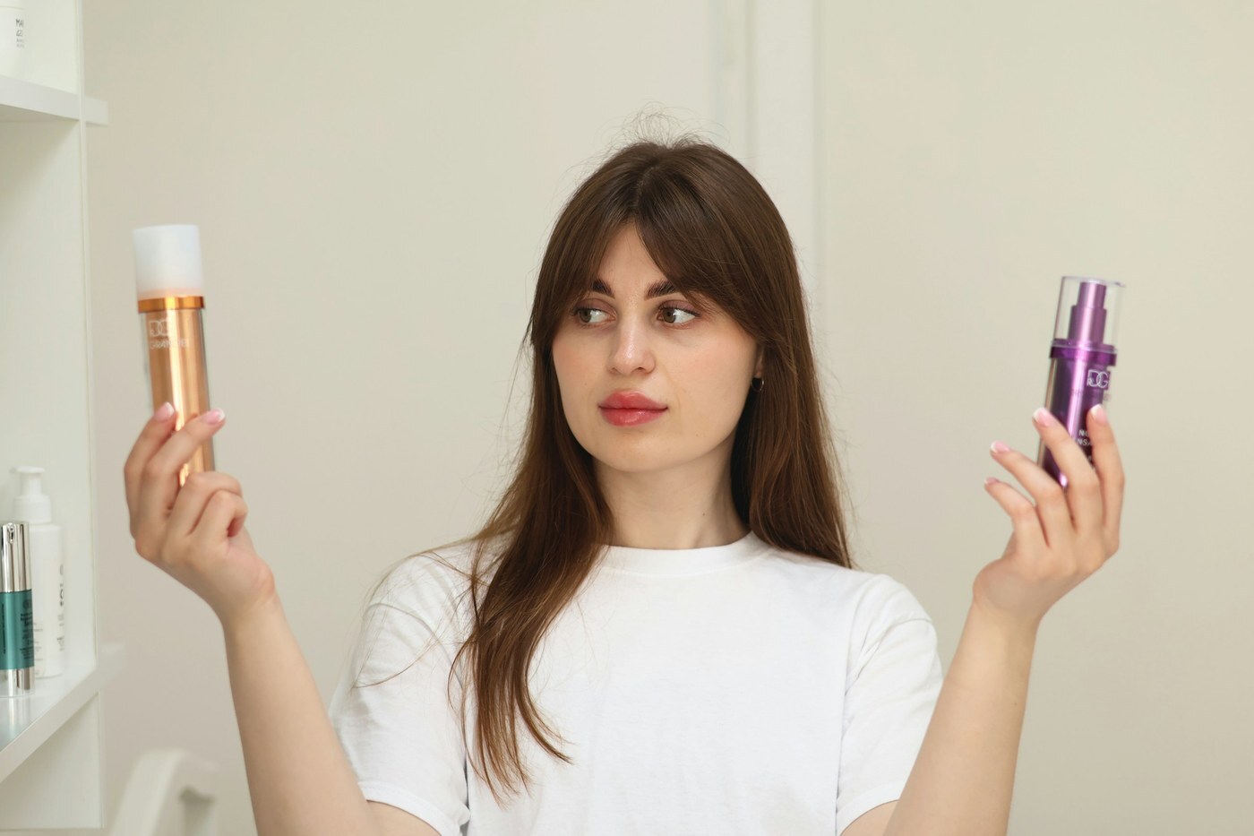 Woman holding two different skincare products side by side and comparing them, representing A/B testing listing content with Amazon Manage Your Experiments